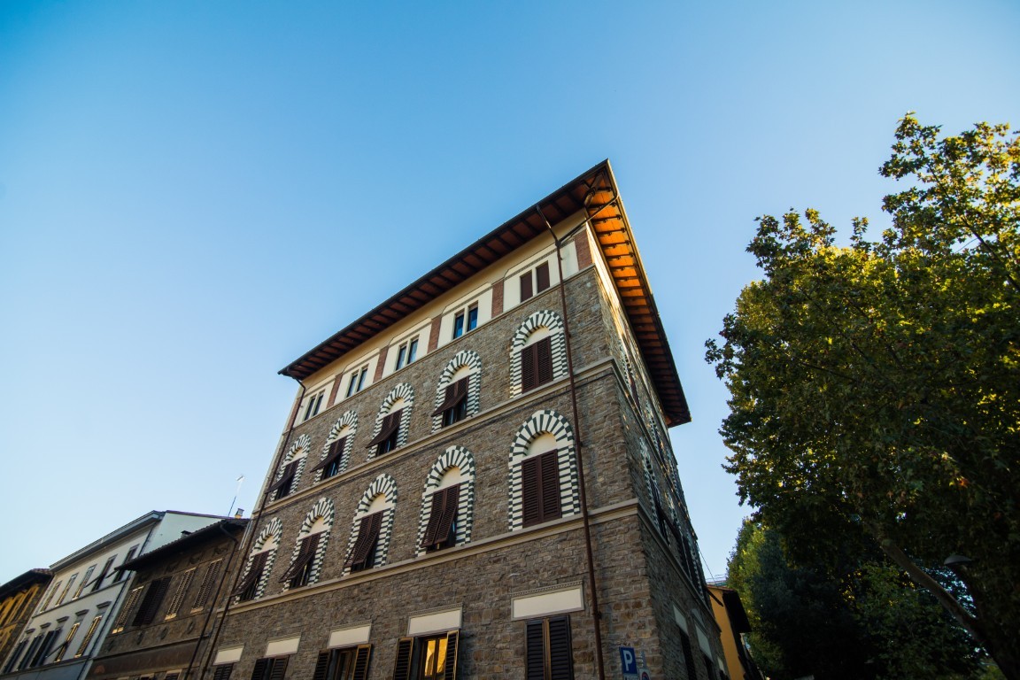 Narrow street in Florence, Tuscany, Italy. Architecture and landmark of Florence. Cozy Florence cityscape