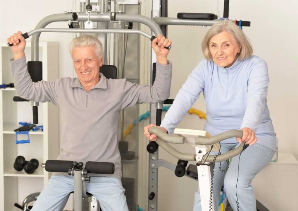 Senior couple exercising in gym