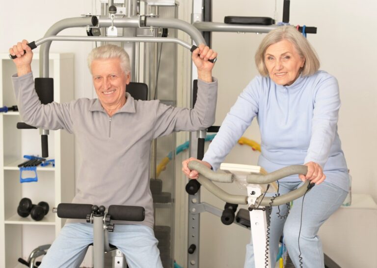 Senior couple exercising in gym