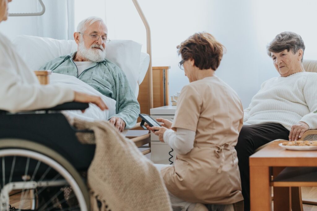 Senior people visiting injured friend in the hospital