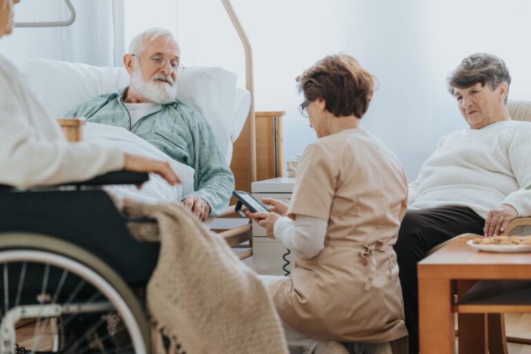 Senior people visiting injured friend in the hospital